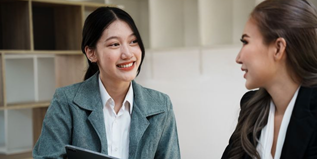 Image — two professionals talking